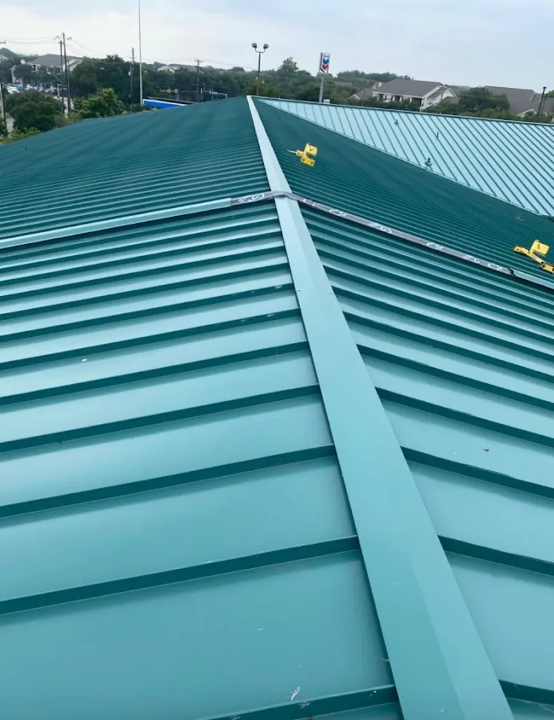 Green commercial metal roof ridge and valley for Metal Roof Repair in Isla Vista