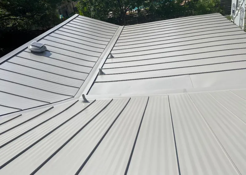 Solar attic fan installed on a metal roof for Roof Ventilation in Isla Vista